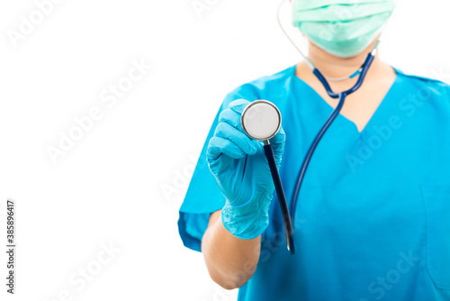 Female nurse puts on rubber gloves and wearing medical face mask, woman doctor in blue uniform holding stethoscope and show to camera, isolated on over white background, medical health concept