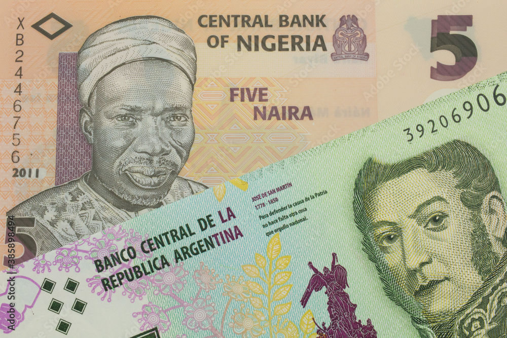 A macro image of a orange, plastic five naira note from Nigeria paired up with a colorful five peso note from Argentina.  Shot close up in macro.