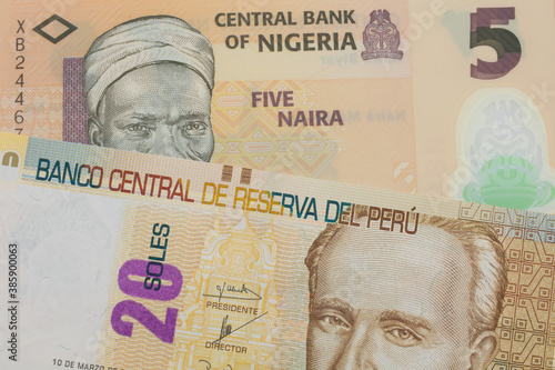 Wallpaper Mural A macro image of a orange, plastic five naira note from Nigeria paired up with a beige, twenty sol bill from Peru.  Shot close up in macro. Torontodigital.ca