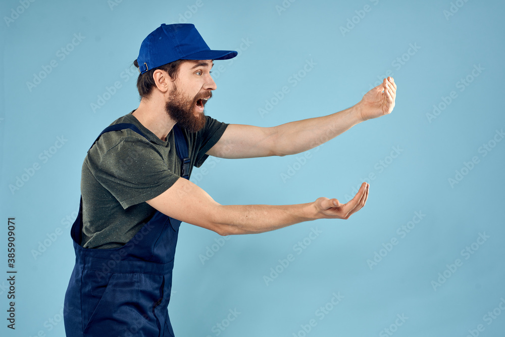 man in work uniform uniform professional work lifestyle delivery service blue background man in work uniform uniform professional work lifestyle delivery service blue background