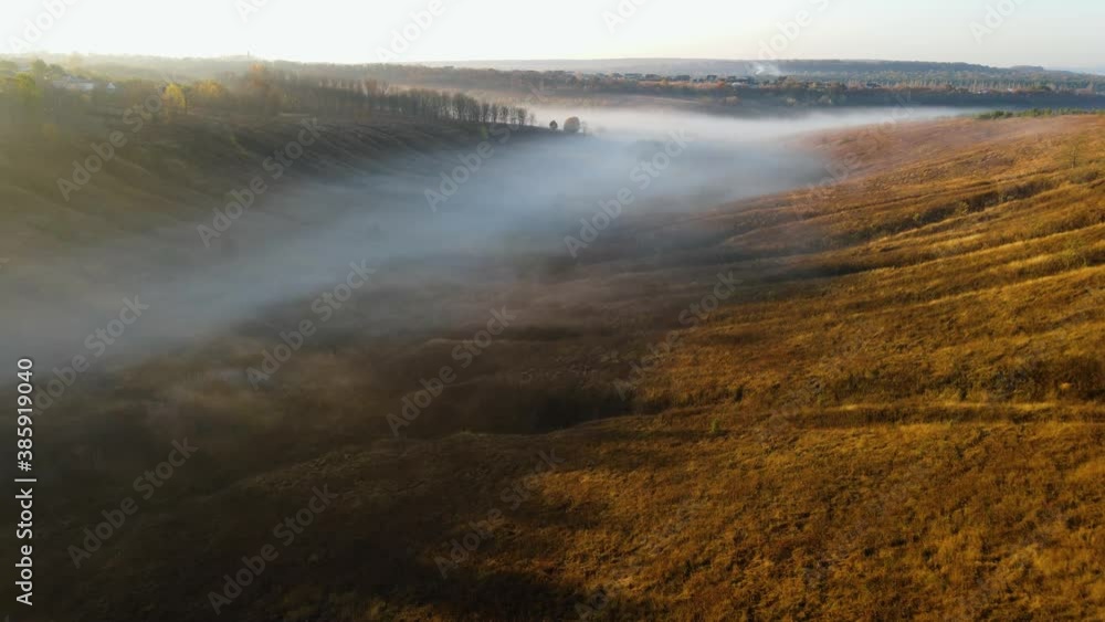 Aerial view to foggy valley autumn season Aerial view to foggy valley autumn season