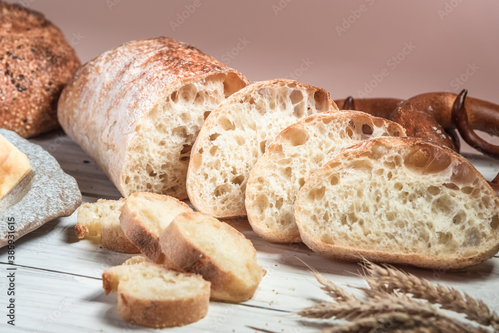 Various rustic bread on a wooden board. Healthy food and farming concept