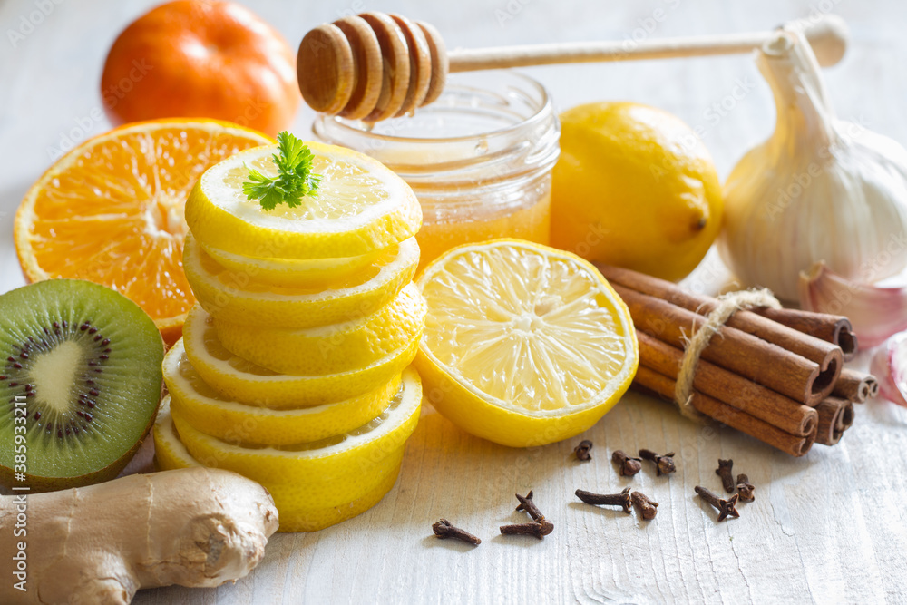 Citrus, honey and garlic as home remedies for colds and flu. Immunity concept - obrazy, fototapety, plakaty 
