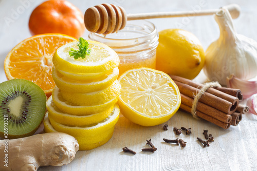 Citrus, honey and garlic as home remedies for colds and flu. Immunity concept photo
