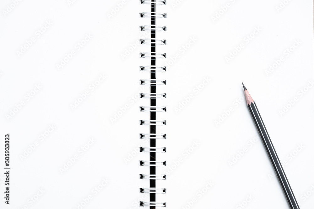 The top image of the white paper spiral notebook and pencil is separate. The top image of the white paper spiral notebook and pencil is separate.