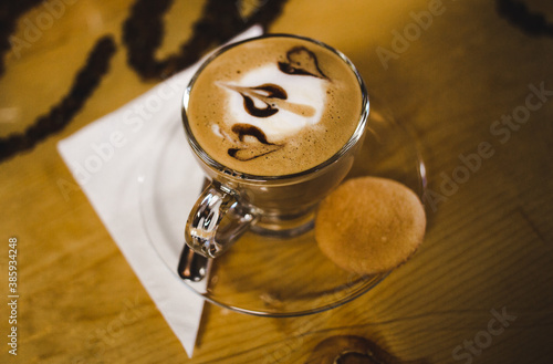 Warm brown tones of a Cuban coffee served with a biscuit in Miami's famous Little Havana district
