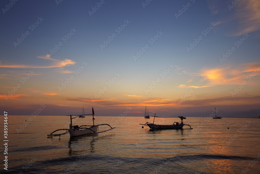 sunrise over fishing boats on Bali sunrise over fishing boats on Bali
