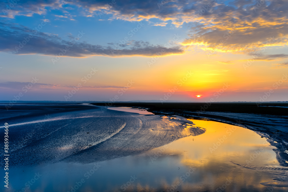 Sunrise View at the mouth of the Couesnon River In Normany, France Sunrise View at the mouth of the Couesnon River In Normany, France