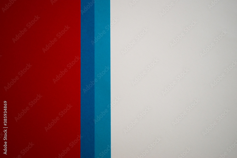 White, blue and red vertically divided colored paper background