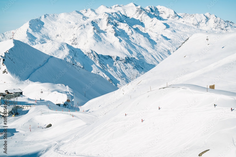 Freeride powder, snowboarding in Les deux alpes resort in winter, mountains in French alps, Rhone Alpes in France