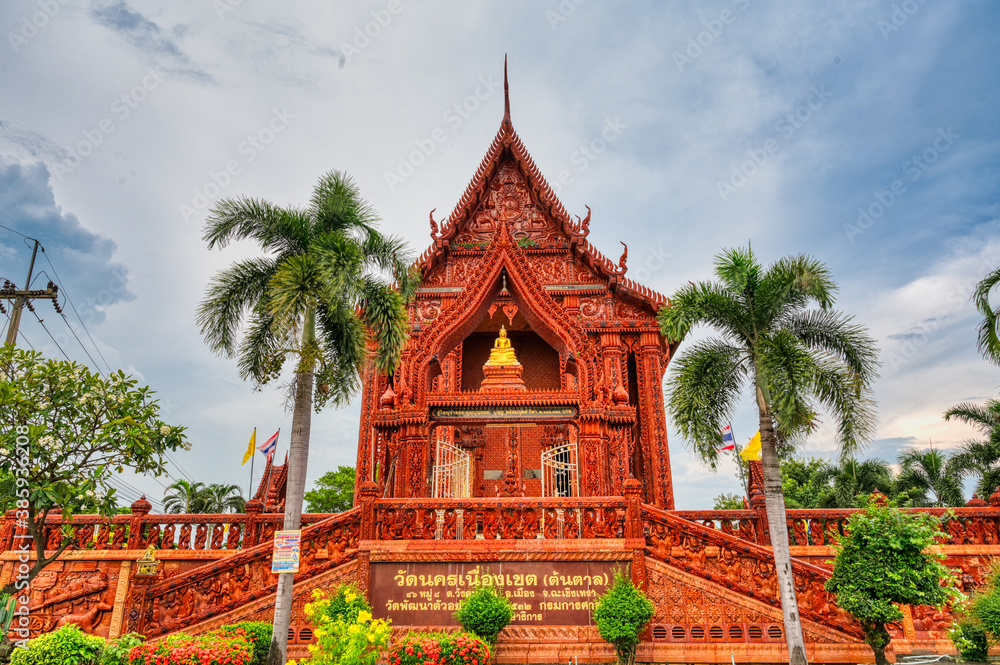 Chachoengsao / Thailand / September 4, 2020 : Wat Nakhon Nueang Khet (Wat Ton Taan), Temple covered in red clay tiles. It is a peaceful temple, not many people personally like it. Beautiful temple..