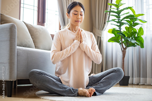 Free Download Asian women do yoga at home. - GFXLoad