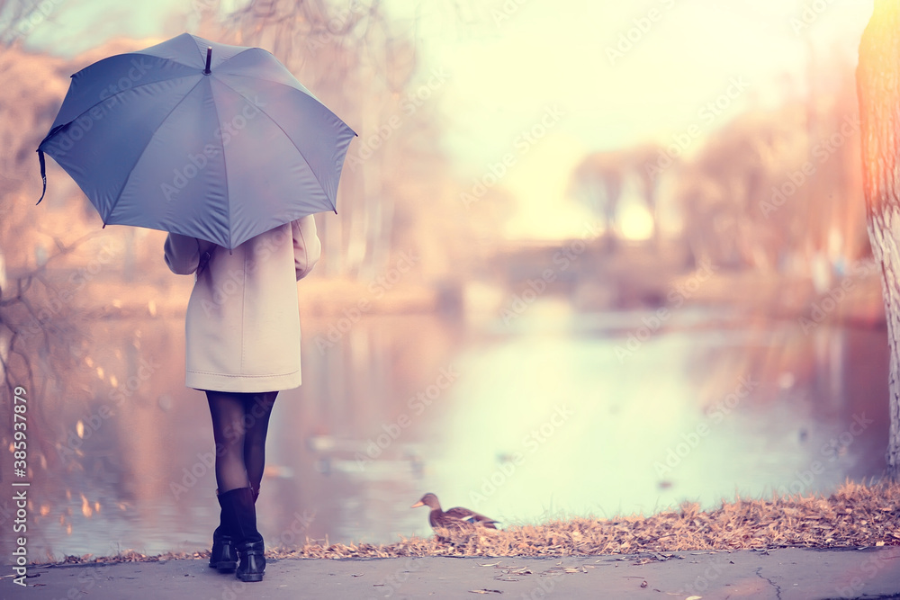 long background girl umbrella / horizontal view rainy autumn day young woman with umbrella