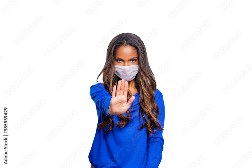 Masked woman - protection against influenza virus. African - American woman wearing medical mask for protect. model poses in studio making hand gesture. Stop the virus and epidemic diseases. isolated Masked woman - protection against influenza virus. African - American woman wearing medical mask for protect. model poses in studio making hand gesture. Stop the virus and epidemic diseases. isolated