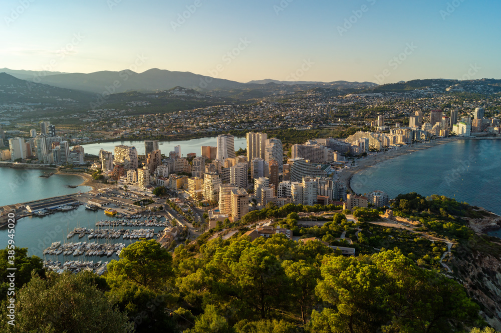 Spectacular views of the city of calpe from the Peñon d'Ifach Natural Park (Alicante, Spain). Beautiful sunset in which you can see the beaches and the mountains that surround the city. 