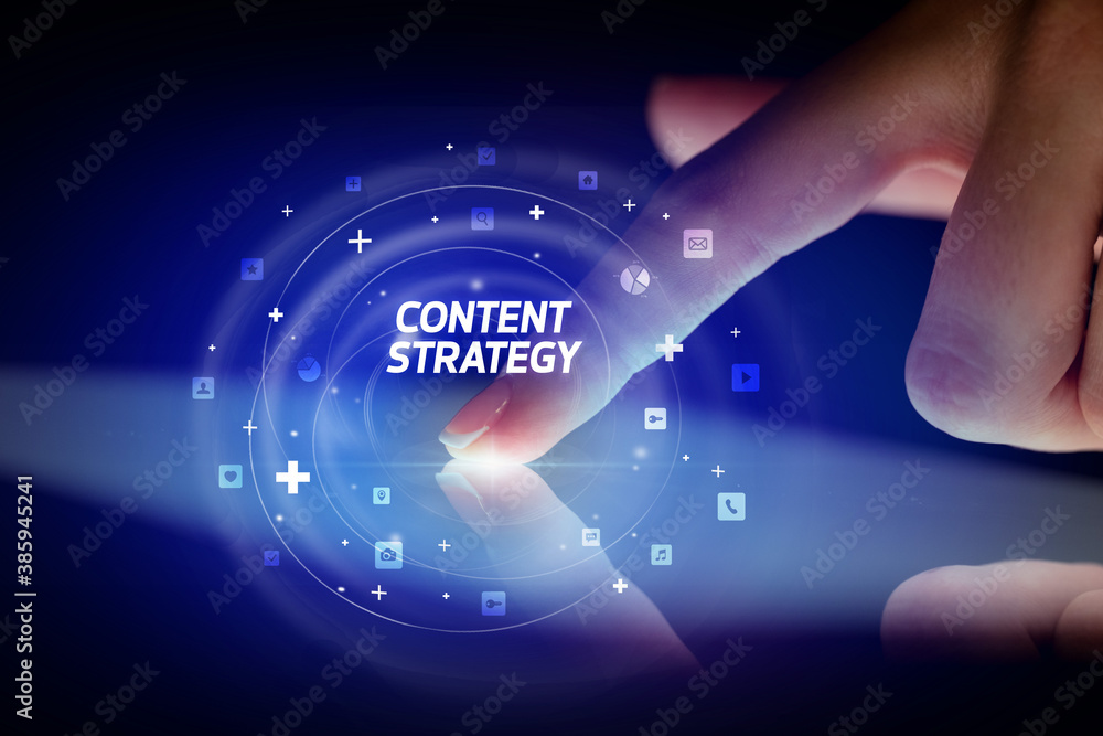 Finger touching tablet with social media icons and CONTENT STRATEGY Finger touching tablet with social media icons and CONTENT STRATEGY
