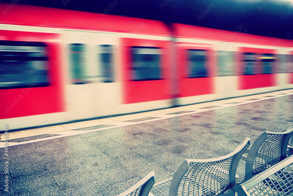 Fototapeta premium Munich underground train of the S-bahn line leaving the station platform