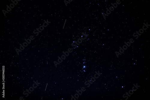 The Orion constellation visible in a starry night sky
