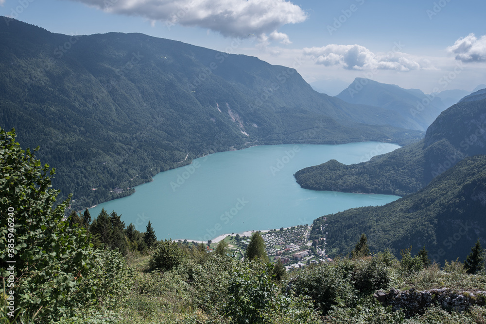 Molveno Lake, located in Trentino, by Molveno village, surrounded by Brenta group in the west & Gazza & Pagenella mountains in the south & east, as seen from Pradel high plain, Dolomites, Italy