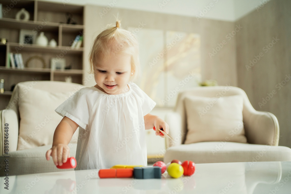portrait of a little girl baby kids playing with toys for children. photos for children's companies, products, and ads. portrait of a little girl baby kids playing with toys for children. photos for children's companies, products, and ads.