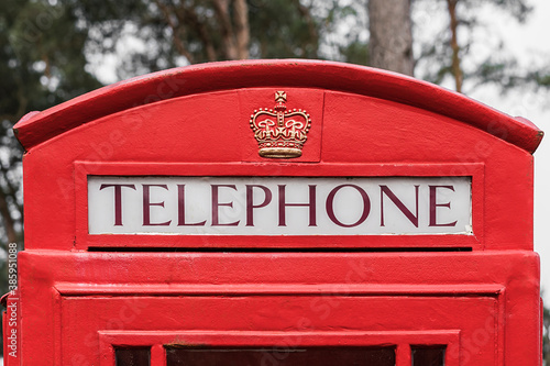 Top of a classic red telephone box.