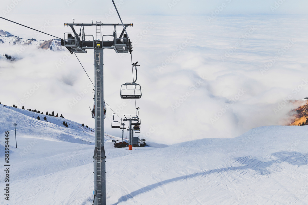 Winter mountains panorama with ski slopes and ski lifts in Tian Shan Winter mountains panorama with ski slopes and ski lifts in Tian Shan