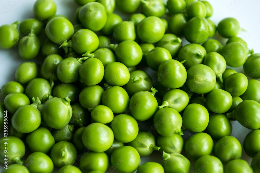 Green peas on an isolated white background. Green peas on an isolated white background.