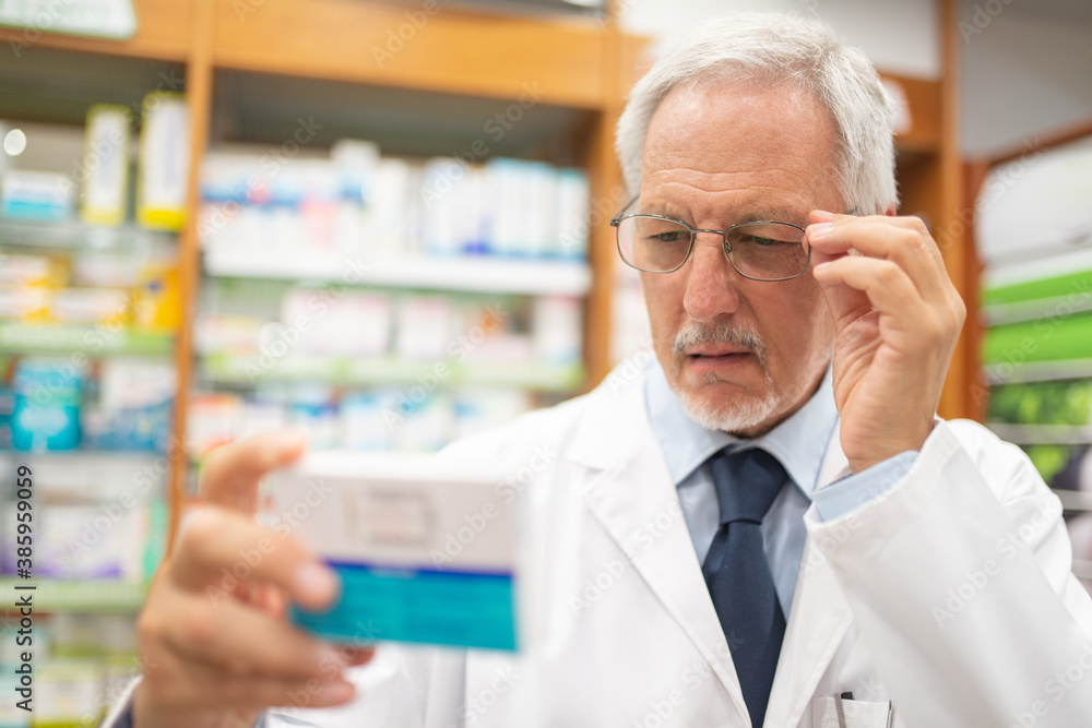 Pharmacist checking a drug