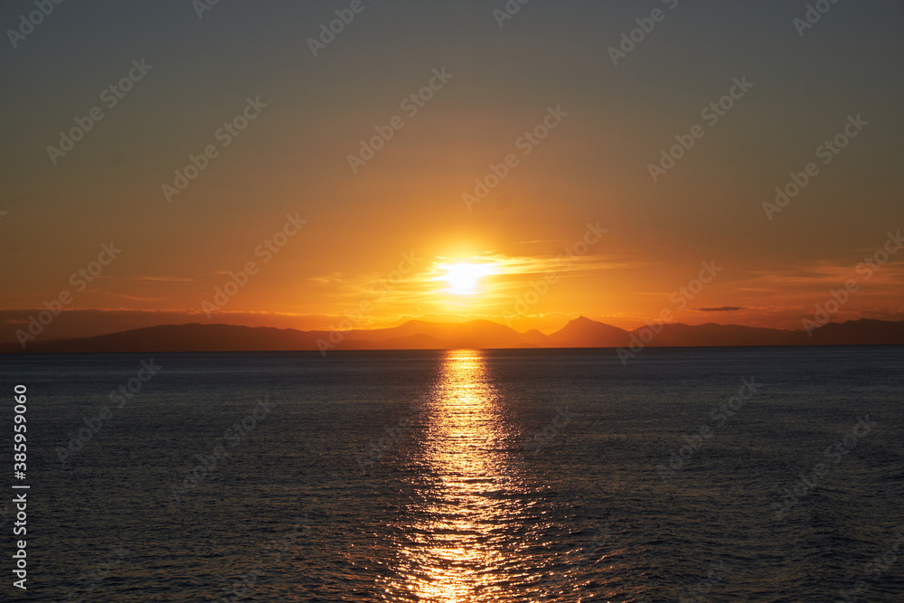 sunset over the sea, from the ferry in Aegean, Greece