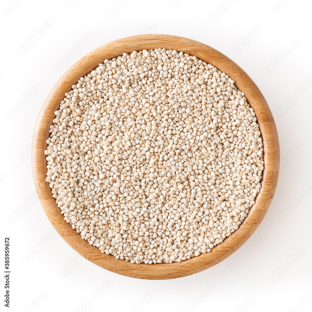 Dried white quinoa seeds in wooden bowl isolated on white background with clipping path