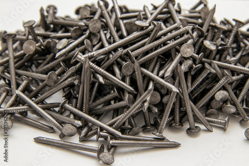 Metal construction nail for roofing. Fasteners product.