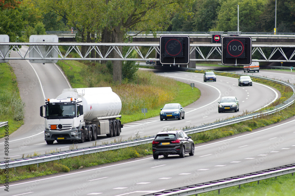 Highway with cars and electronic speed sign in Arnhem, Netherlands