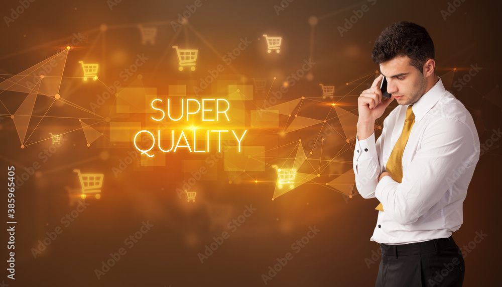 Businessman with shopping cart icons and SUPER QUALITY inscription, online shopping concept Businessman with shopping cart icons and SUPER QUALITY inscription, online shopping concept