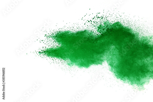 Green powder explosion on white background.