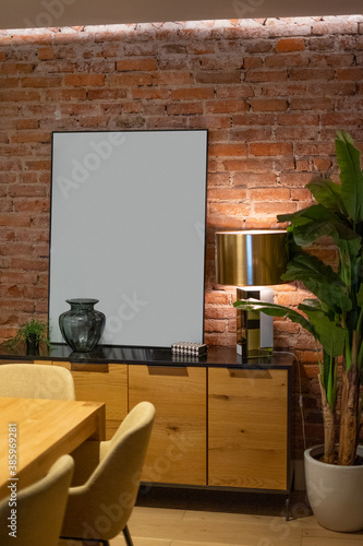 Mockup of a living room with an empty frame