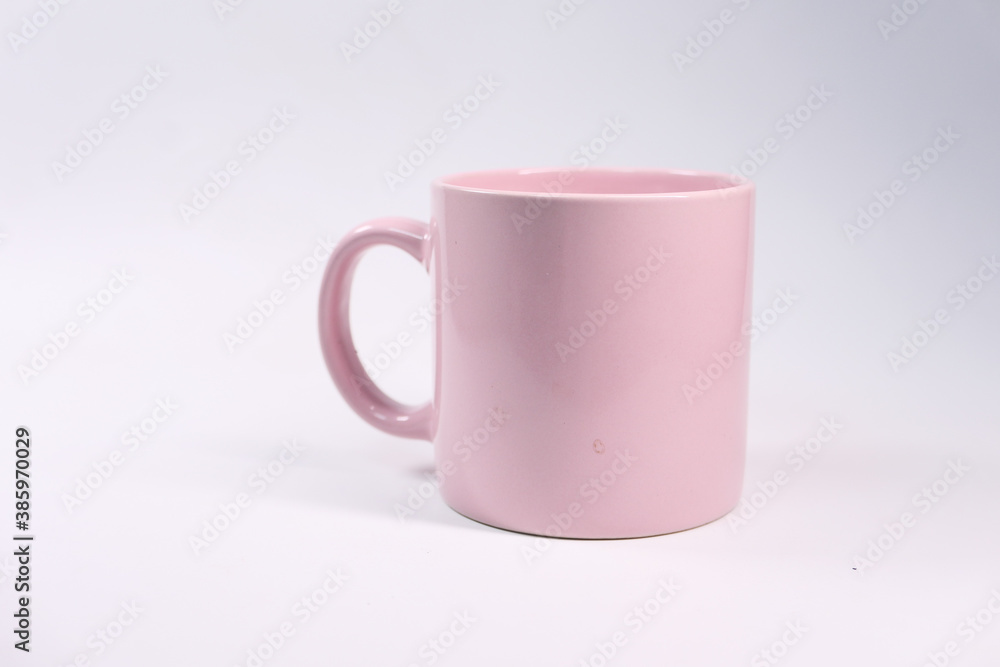 Close up of pink color coffee mug on white background Close up of pink color coffee mug on white background
