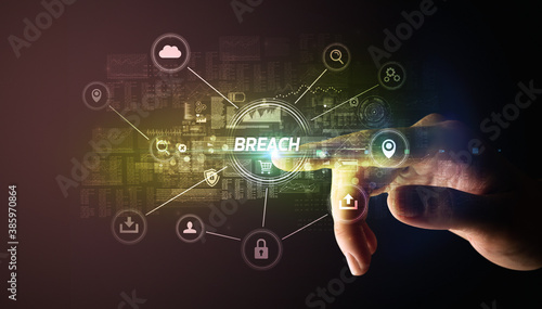 Hand touching BREACH inscription, Cybersecurity concept