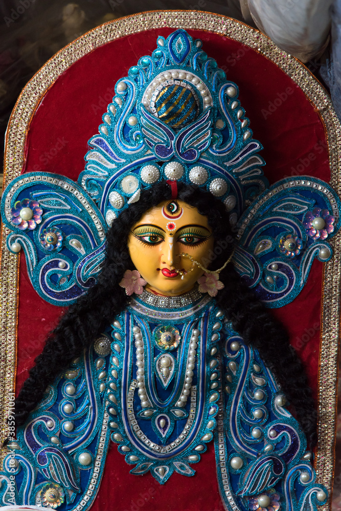 Close up of a traditional face of Hindu Goddess Durga with use of selective focus.
