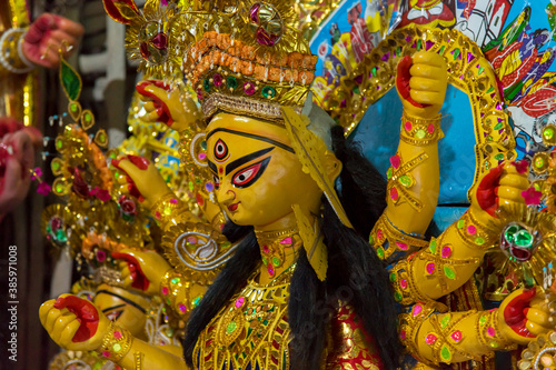 View from side of a traditional idol of Goddess Durga with use of selective focus.