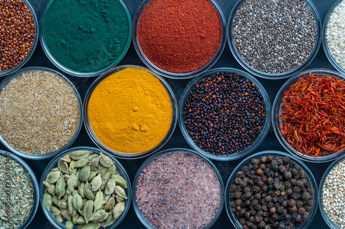 Assortment colorful spices, seeds and herbs for cooking food, top view