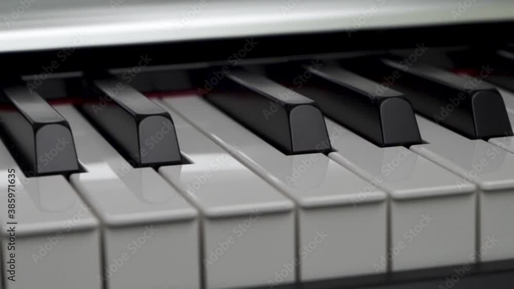 Elegant piano keys moving, close up.Tracking backwards shot. Slow motion. Black and white keys. Reflection on piano keys. Music, learn, artistic, hobbies, black and white concepts. Elegant piano keys moving, close up.Tracking backwards shot. Slow motion. Black and white keys. Reflection on piano keys. Music, learn, artistic, hobbies, black and white concepts.