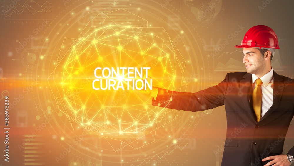 Handsome businessman with helmet drawing CONTENT CURATION inscription, social construction concept Handsome businessman with helmet drawing CONTENT CURATION inscription, social construction concept