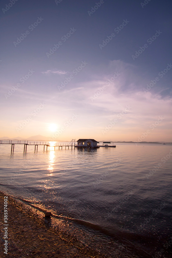 Beautiful sunset with Wooden bridge over the sea in sacheon city, Korea
Beautiful sunset with Wooden bridge over the sea in sacheon city, Korea