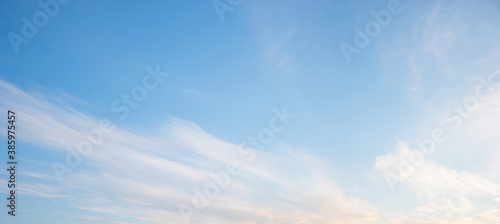 light blue sky with soft cirrus clouds and copy space photo