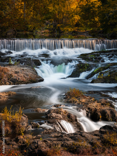 Fototapeta Naklejka Na Ścianę i Meble -  Water flowing down a small picturesque waterfall. Madam Brett Park - Beacon, New York. 
 
