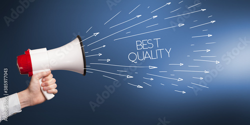 Photos Young girl screaming to megaphone with BEST QUALITY inscription, shopping concep