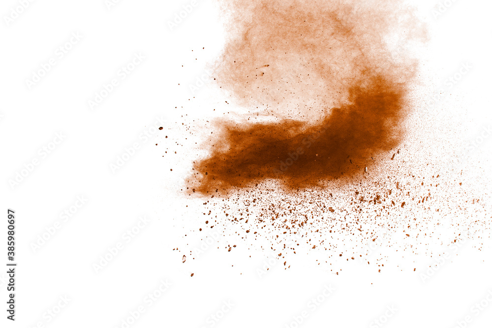 Brown dust splashing.Brown particles splattered on white background.