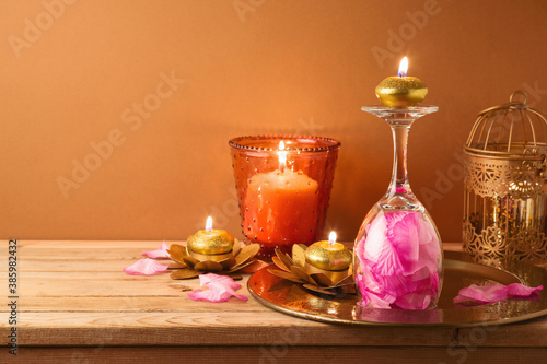 Diwali holiday home decorations on wooden table. photo