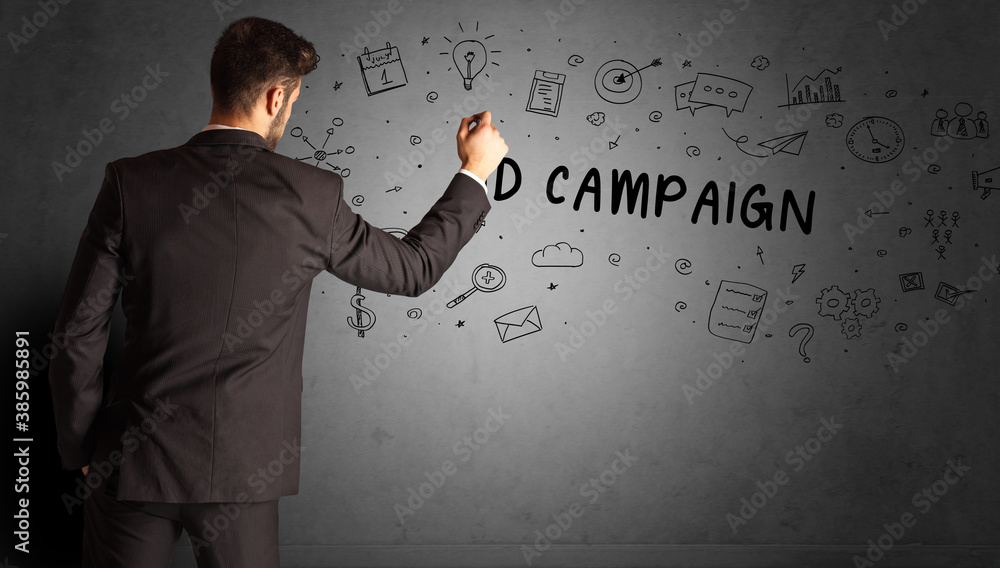 businessman drawing a creative idea sketch with AD CAMPAIGN inscription, business strategy concept businessman drawing a creative idea sketch with AD CAMPAIGN inscription, business strategy concept