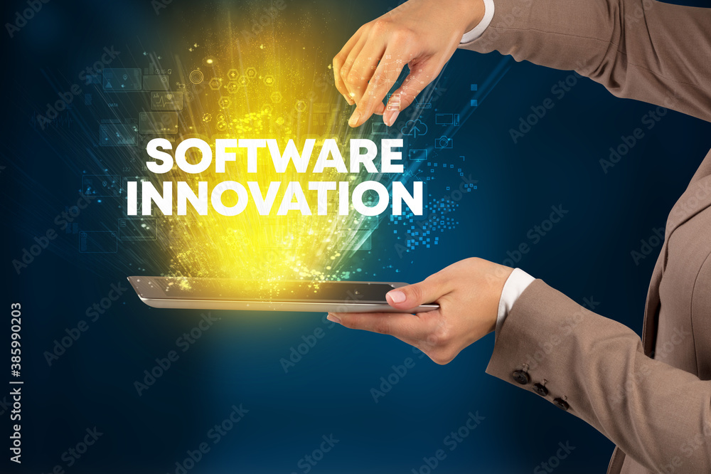 Obraz premium Close-up of a touchscreen with SOFTWARE INNOVATION inscription, innovative technology concept